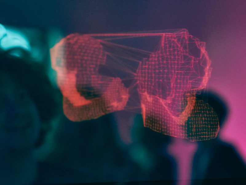 Photo by Ashwin Vaswani man loking at hologram